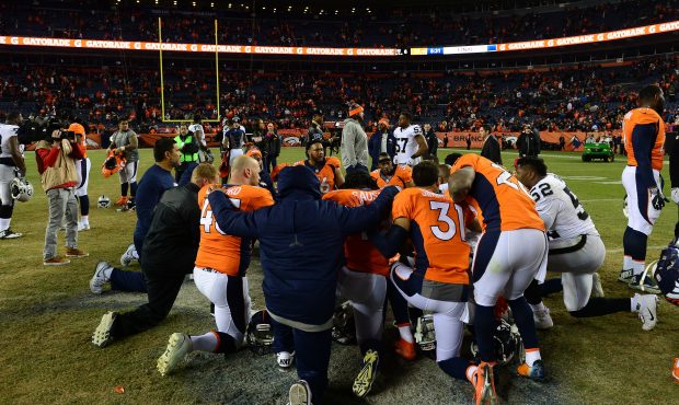 DENVER, CO - JANUARY 1:  Denver Broncos players huddle together after defeating the Oakland Raiders...