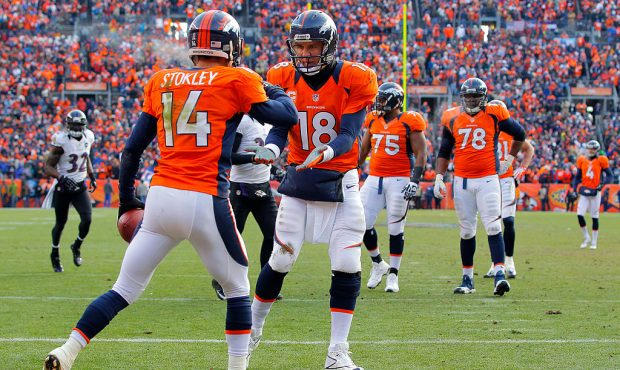 DENVER, CO - JANUARY 12:  Peyton Manning #18 oand Brandon Stokley #14 of the Denver Broncos celebra...