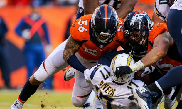 DENVER, CO - JANUARY 3:  Quarterback Philip Rivers #17 of the San Diego Chargers is hit and sacked ...