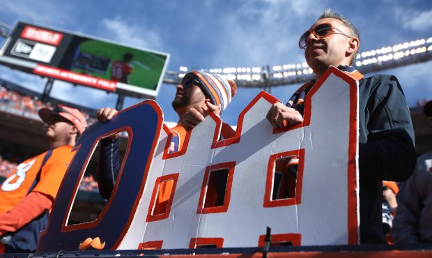DENVER, CO - JANUARY 24: Fans hold a 'defense' sign prior to the AFC Championship game between the ...