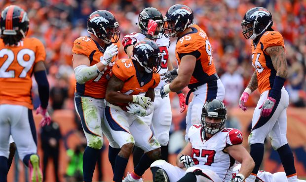 DENVER, CO - OCTOBER 9:  Strong safety T.J. Ward #43 of the Denver Broncos celebrates with teammate...