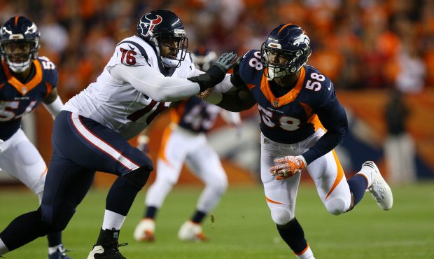 DENVER, CO - OCTOBER 24:  Outside linebacker Von Miller #58 of the Denver Broncos is blocked while ...
