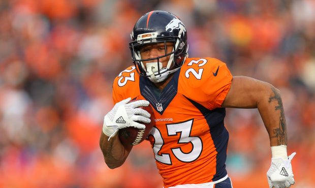 DENVER, CO - JANUARY 1: Running back Devontae Booker #23 of the Denver Broncos rushes for a touchdo...