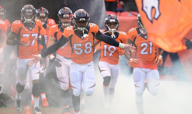 DENVER, CO - JANUARY 1:  Outside linebacker Von Miller #58 of the Denver Broncos leads the team out...