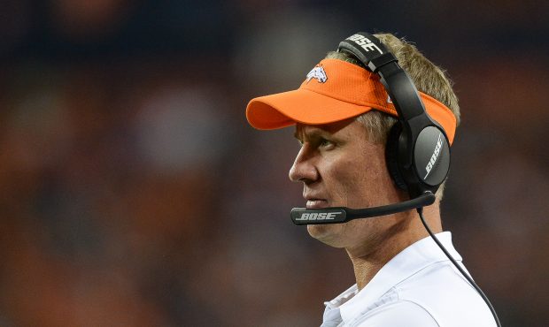 DENVER, CO - AUGUST 31: Offensive coordinator MiKe McCoy of the Denver Broncos looks on during a pr...