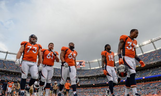 DENVER, CO - AUGUST 31: Denver Broncos players, including Allen Barbre #73, Nelson Adams #61, Ronal...