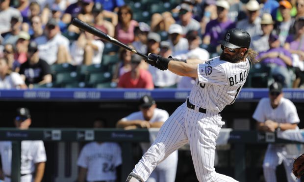 DENVER, CO - SEPTEMBER 03: Charlie Blackmon #19 of the Colorado Rockies hits a RBI single against t...
