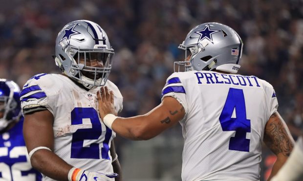 ARLINGTON, TX - SEPTEMBER 10:  Ezekiel Elliott #21 of the Dallas Cowboys gets pat on the chest from...