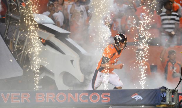 DENVER, CO - SEPTEMBER 11:  Quarterback Trevor Siemian #13 of the Denver Broncos runs on to the fie...