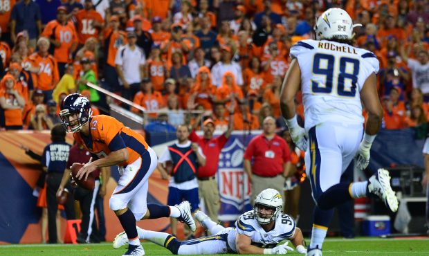 DENVER, CO - SEPTEMBER 11:  Quarterback Trevor Siemian #13 of the Denver Broncos rushes for a touch...