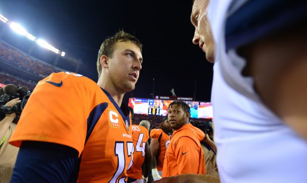 DENVER, CO - SEPTEMBER 11: Quarterback Trevor Siemian #13 of the Denver Broncos talks with quarterb...