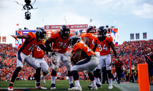 DENVER, CO - SEPTEMBER 17: Running back C.J. Anderson #22 of the Denver Broncos celebrates a third ...