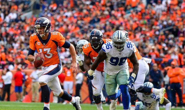 DENVER, CO - SEPTEMBER 17:  Quarterback Trevor Siemian #13 of the Denver Broncos scrambles against ...