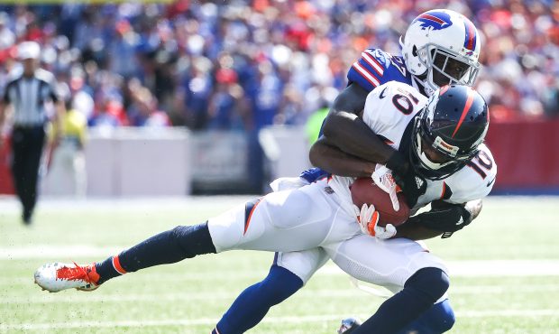 ORCHARD PARK, NY - SEPTEMBER 24:  Emmanuel Sanders #10 of the Denver Broncos is tackled by Tre'Davi...