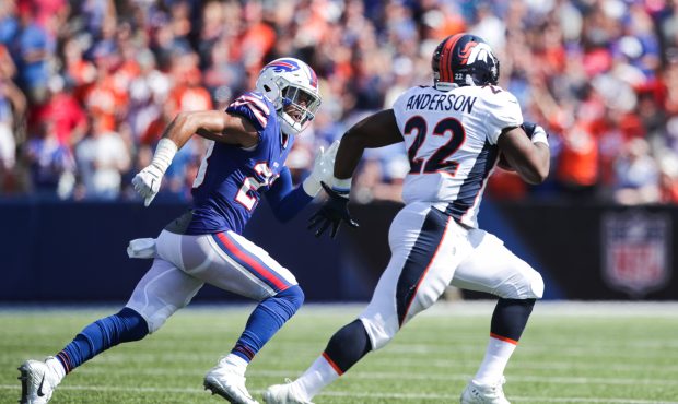 ORCHARD PARK, NY - SEPTEMBER 24:  Micah Hyde #23 of the Buffalo Bills runs after C.J. Anderson #22 ...