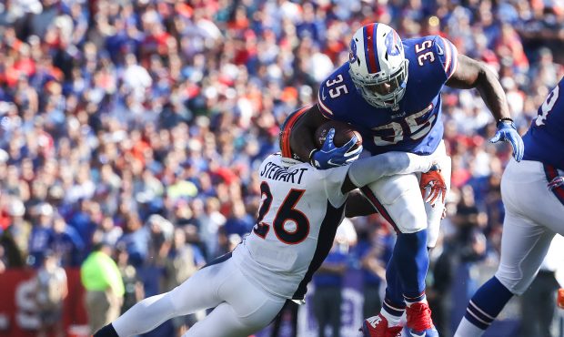 ORCHARD PARK, NY - SEPTEMBER 24:  Darian Stewart #26 of the Denver Broncos attempts to tackle Mike ...