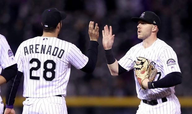 DENVER, CO - SEPTEMBER 26:  Nolan Arenado # 28 and Trevor Story #27 of the Colorado Rockies celebra...