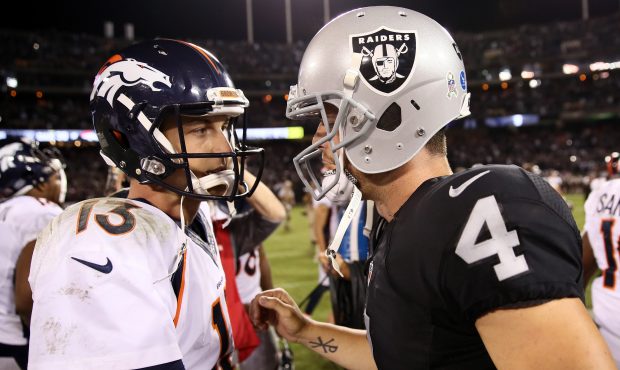 OAKLAND, CA - NOVEMBER 06:   Quarterbacks Derek Carr #4 of the Oakland Raiders and Trevor Siemian #...