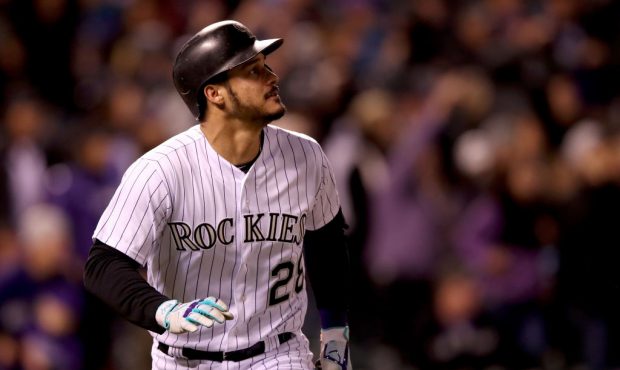 DENVER, CO - SEPTEMBER 26:  Nolan Arenado #28 of the Colorado Rockies hits a 2 RBI home run in the ...