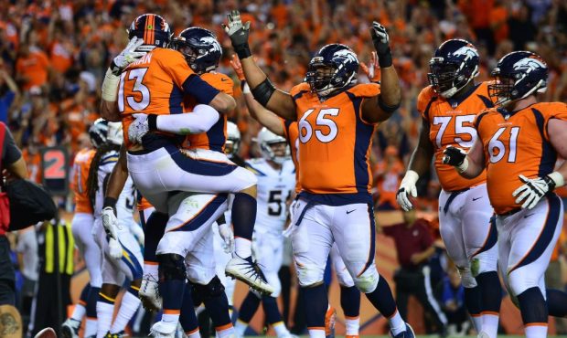 DENVER, CO - SEPTEMBER 11:  Quarterback Trevor Siemian #13 of the Denver Broncos celebrates a touch...