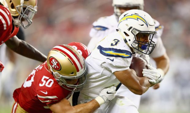 SANTA CLARA, CA - AUGUST 31:  Austin Ekeler #3 of the Los Angeles Chargers is tackled by Brock Coyl...