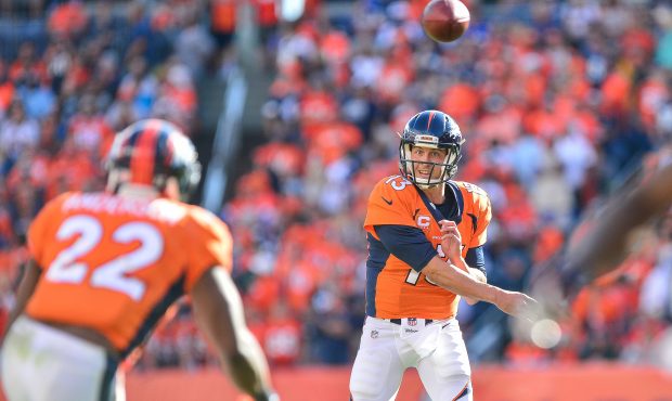 DENVER, CO - SEPTEMBER 17:  Quarterback Trevor Siemian #13 of the Denver Broncos passes to running ...