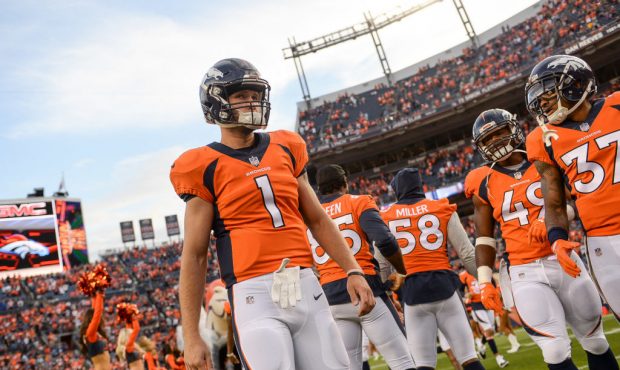 DENVER, CO - AUGUST 31: Quarterback Kyle Sloter #1 of the Denver Broncos walks on the field during ...