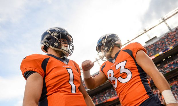 DENVER, CO - AUGUST 31: Quarterback Kyle Sloter #1 of the Denver Broncos walks on the field along w...
