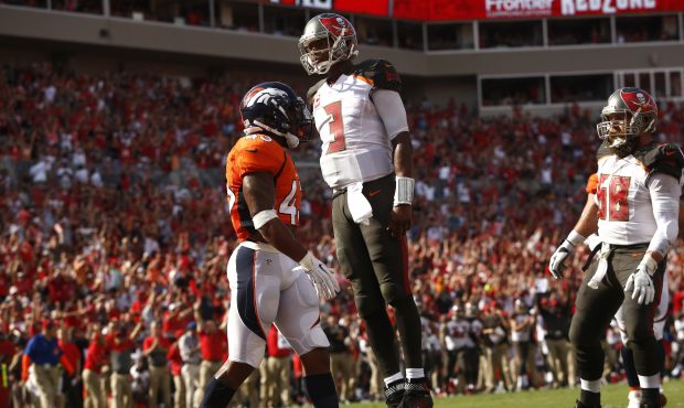 TAMPA, FL - OCTOBER 2:  Quarterback Jameis Winston #3 of the Tampa Bay Buccaneers leaps up in front...