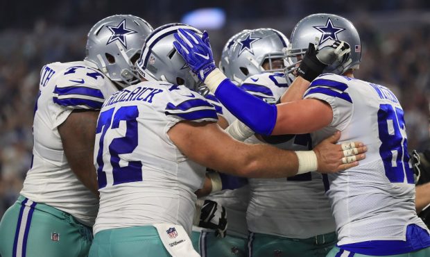 ARLINGTON, TX - SEPTEMBER 10:  Tyron Smith #77 of the Dallas Cowboys and Travis Frederick #72 of th...