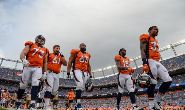 DENVER, CO - AUGUST 31: Denver Broncos players, including Allen Barbre #73, Nelson Adams #61, Ronal...