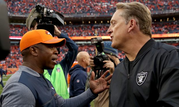 DENVER, CO - OCTOBER 01: Head coach Vance Joseph of the Denver Broncos is congratulated by head coa...