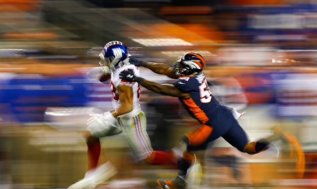 DENVER, CO - OCTOBER 15:  Tight end Evan Engram #88 of the New York Giants runs towards the sidelin...