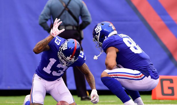 EAST RUTHERFORD, NJ - OCTOBER 08:  Odell Beckham #13 of the New York Giants is congratulated by his...