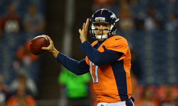 DENVER, CO - SEPTEMBER 11:  Quarterback Brock Osweiler #17 of the Denver Broncos warms up before th...