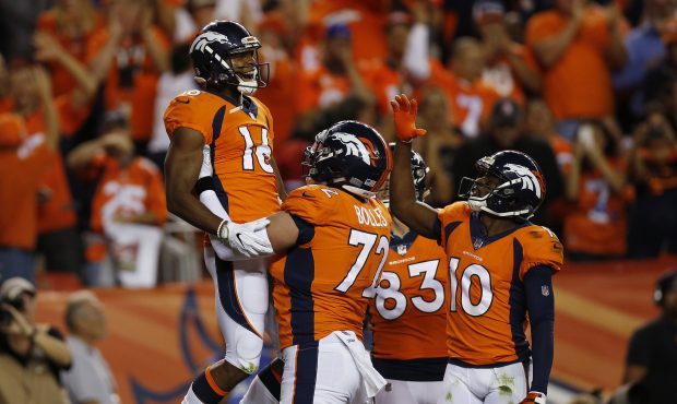 DENVER, CO - SEPTEMBER 11:  Bennie Fowler #16 celebrates a touchdown catch with offensive tackle Ga...