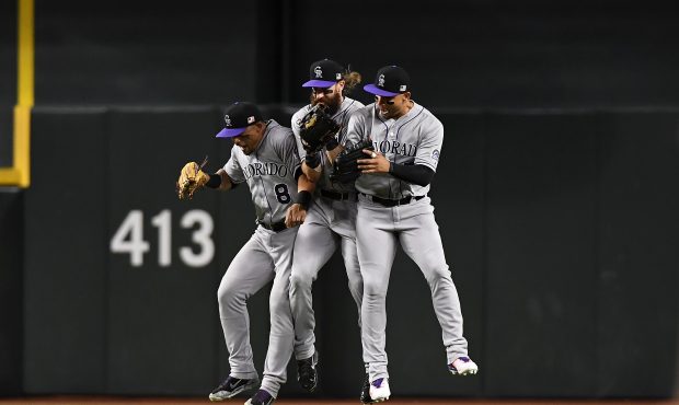 PHOENIX, AZ - SEPTEMBER 11:  Gerardo Parra #8, Charlie Blackmon #19 and Carlos Gonzalez #5 of the C...