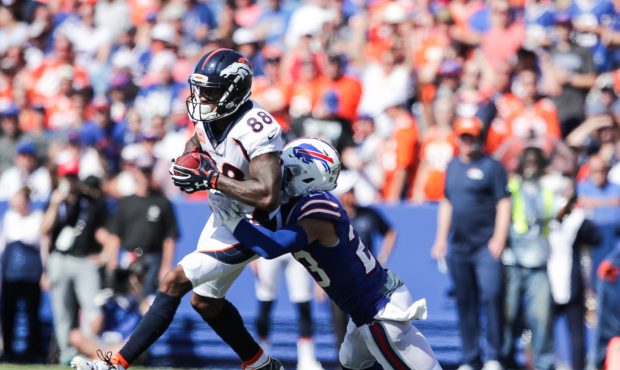 ORCHARD PARK, NY - SEPTEMBER 24:  Demaryius Thomas #88 of the Denver Broncos runs the ball as Micah...