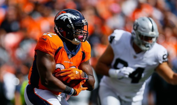 DENVER, CO - OCTOBER 1: Running back C.J. Anderson #22 of the Denver Broncos rushes against the Oak...
