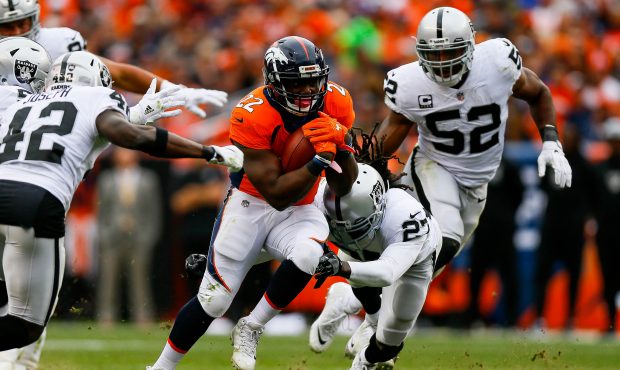 DENVER, CO - OCTOBER 1:  Running back C.J. Anderson #22 of the Denver Broncos rushes against the Oa...