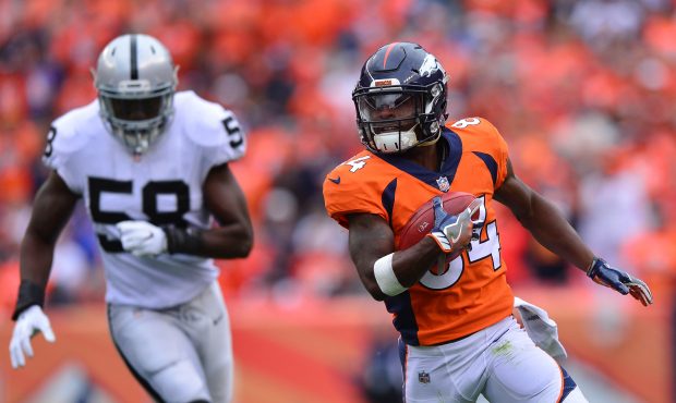 DENVER, CO - OCTOBER 1: Wide receiver Isaiah McKenzie #84 of the Denver Broncos returns a kickoff a...