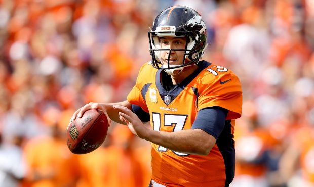 DENVER, CO - OCTOBER 01:  Trevor Siemian #13 of the Denver Broncos rolls out of the pocket against ...