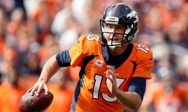 DENVER, CO - OCTOBER 01:  Trevor Siemian #13 of the Denver Broncos rolls out of the pocket against ...