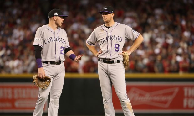 PHOENIX, AZ - OCTOBER 04: DJ LeMahieu #9 of the Colorado Rockies talks with Trevor Story #27 during...