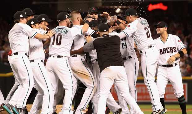 PHOENIX, AZ - OCTOBER 04: Chris Herrmann #10 and Brandon Drury #27 of the Arizona Diamondbacks cele...