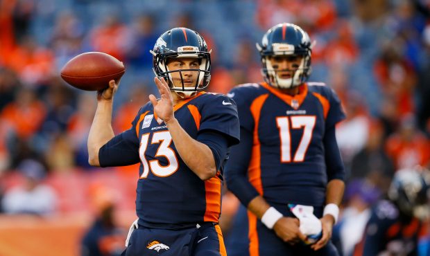 DENVER, CO - OCTOBER 15: Quarterback Trevor Siemian #13 of the Denver Broncos warms up as backup Qu...