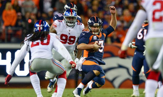 DENVER, CO - OCTOBER 15:  Quarterback Trevor Siemian #13 of the Denver Broncos slides after a 9-yar...