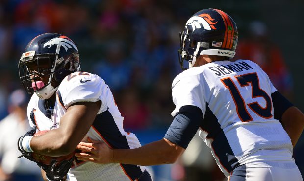 CARSON, CA - OCTOBER 22:  Trevor Siemian #13 of the Denver Broncos hands the ball off to C.J. Ander...