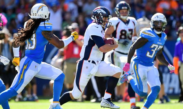 CARSON, CA - OCTOBER 22:  Trevor Siemian #13 of the Denver Broncos scrambles out of the pocket in t...
