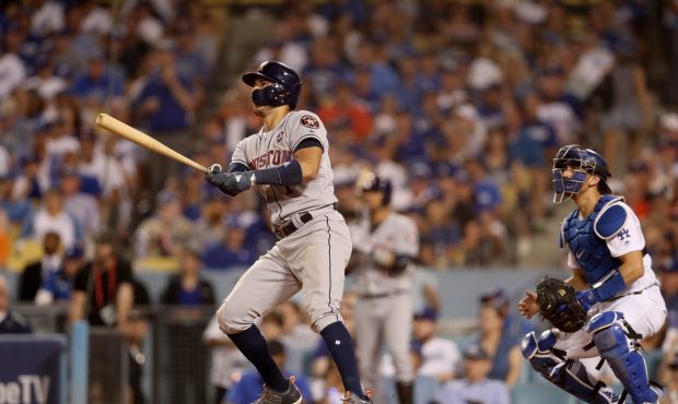 LOS ANGELES, CA - OCTOBER 25:  Carlos Correa #1 of the Houston Astros hits a solo home run during t...